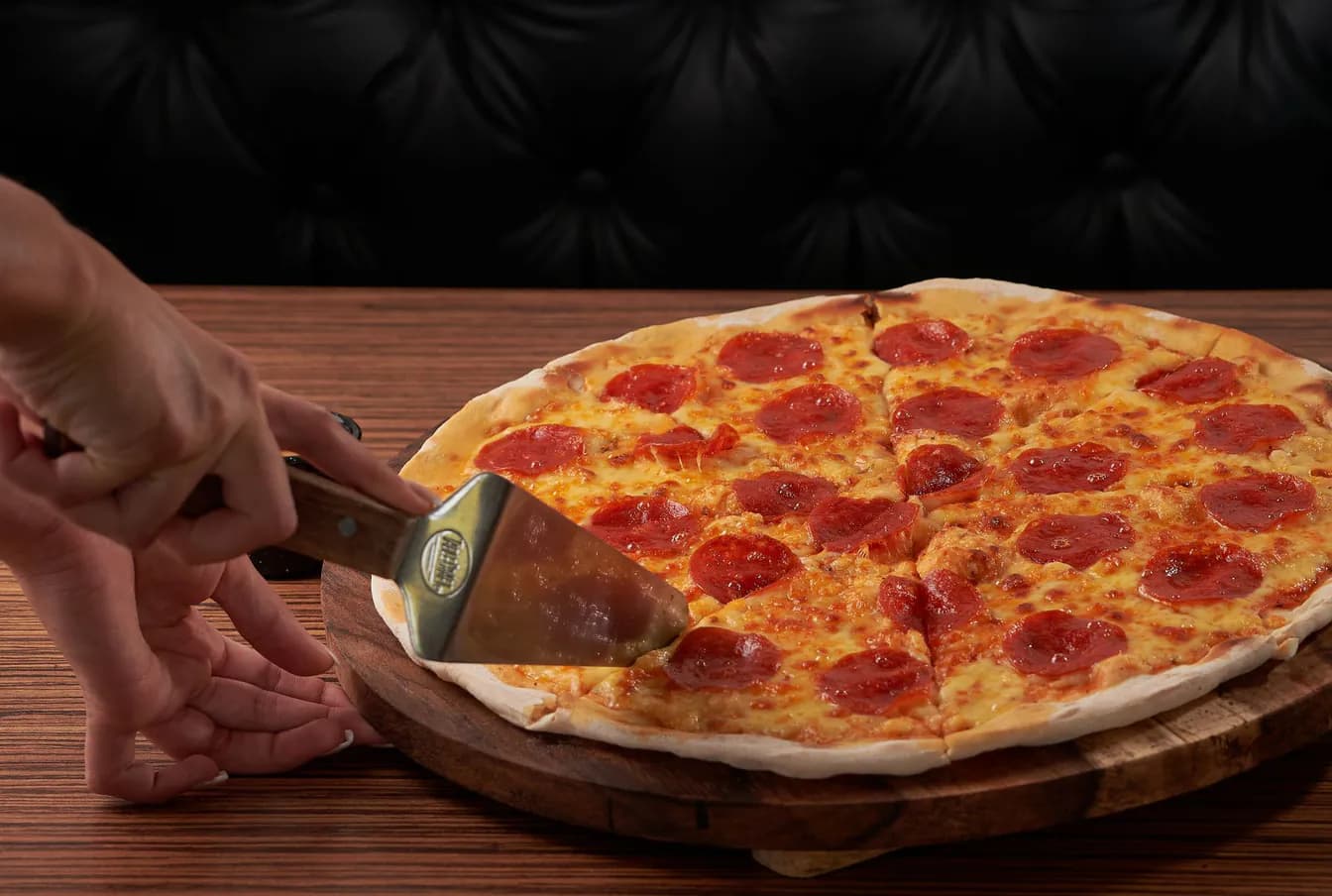 Free Large Pizza with the purchase of a large pizza at menu price (of equal or lesser value)